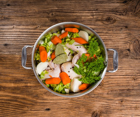 Metal stock pot with soup ingredients