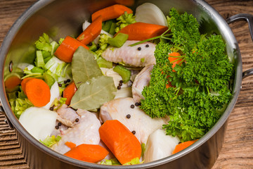 Metal stock pot with soup ingredients