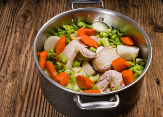 Metal stock pot with soup ingredients