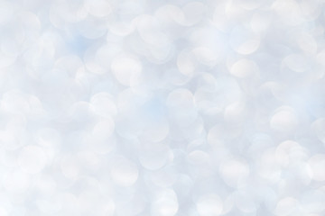 Silver glittering christmas lights. Blurred abstract background