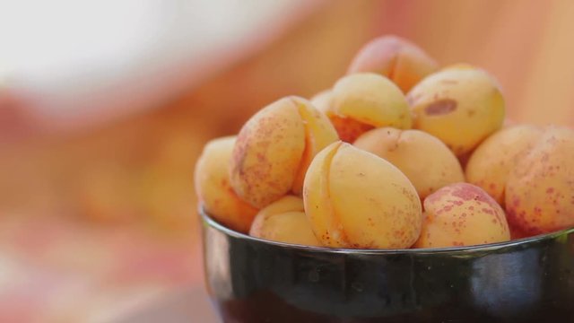 Apricots in ceramic bowl