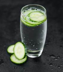Cucumber Water on a vintage slate slab, selective focus