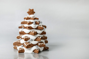 Gingerbread Christmas tree on silver background