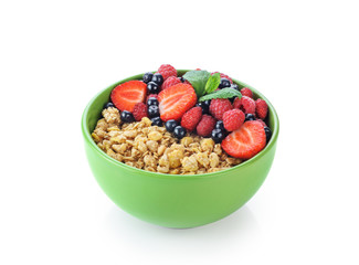 Muesli with fresh berries in a bowl isolated on white background.