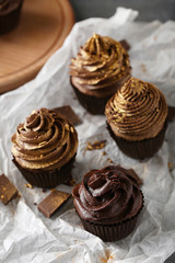Tasty cupcakes with pieces of chocolate