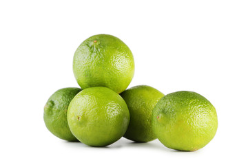 Ripe limes isolated on white background