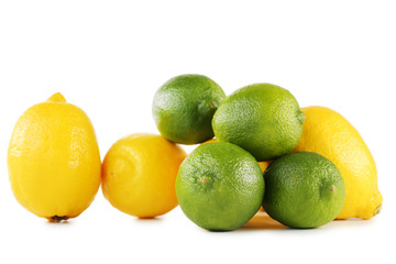 Ripe limes and lemons isolated on white