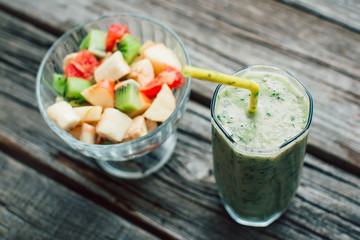 fresh fruit salad in a bowl and smoothies