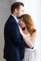 love concept - young beautiful couple at home