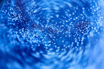 Abstract blue bokeh texture background. Drop on spider web