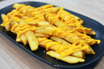 Delicious french fries with cheese