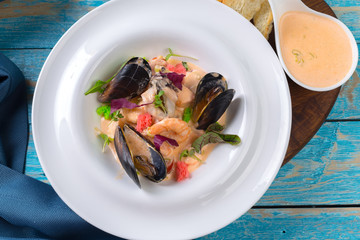 Tasty seafood on plate on table close-up