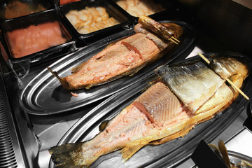 Tray with smoked fish in supermarket