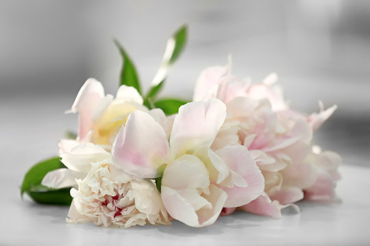 Fototapeta Beautiful peonies on table, closeup