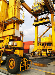 Close Up Wheel Rubber Tried Gantry Cranes (RTG) At Industrial Port