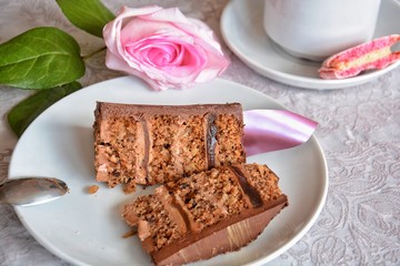 Two pieces of chocolate cake on a white plate