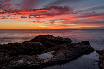 Pink clouds over the ocean