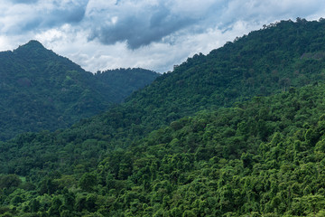 Fototapeta na wymiar Beautiful landscape of green high mountain and sky in cloudy day