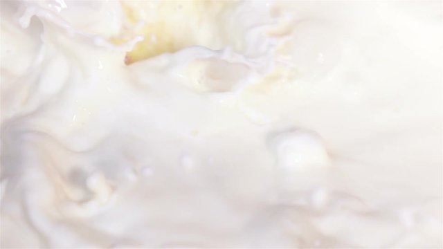  High quality video of pieces of pineapple falling into milk in real 1080p slow motion 250fps