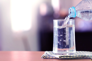 The Glass of the purified water on the table bar in kitchenroom