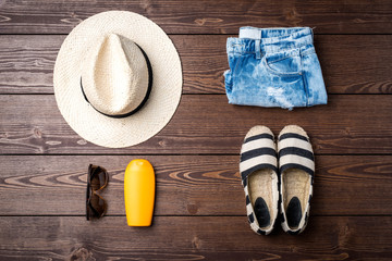 Casual female clothes on wooden table