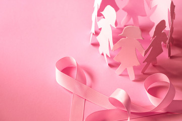The Sweet pink ribbon shape with girl paper doll on pink background  for Breast Cancer Awareness...