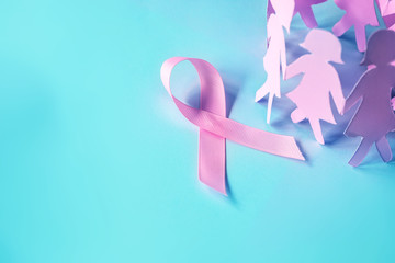 The Sweet pink ribbon shape with girl paper doll on blue background  for Breast Cancer Awareness symbol to promote  in october month campaign