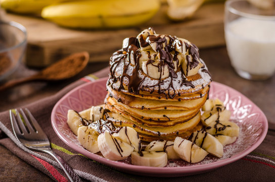 American pancakes with banana, chocolate