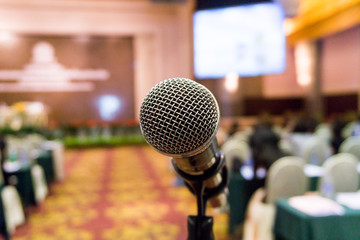 Microphone in meeting room, conference blur Background.