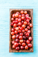 Ripe gooseberry in awooden cup