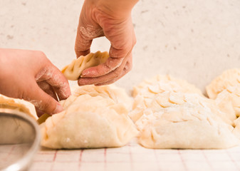 Selecting Homemade Dumpling for Steaming.