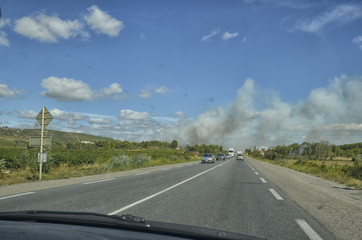 Smoke of an arson from inside the car