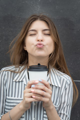 Beautiful girl with a glass of coffee