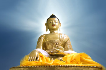 Fototapeta premium Buddha statue on blue sky