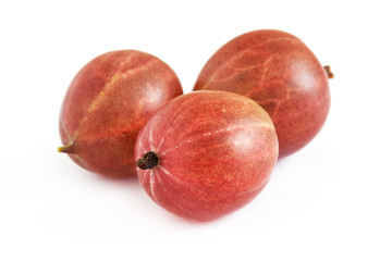Closeup of ripe red gooseberries isolated on white background