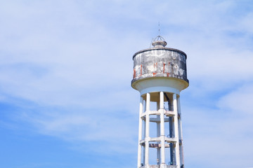 water tank tower old for agriculture on blue sky background with copy space add text
