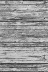 Old gray shabby wooden planks with cracked color paint
