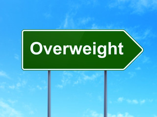 Medicine concept: Overweight on road sign background