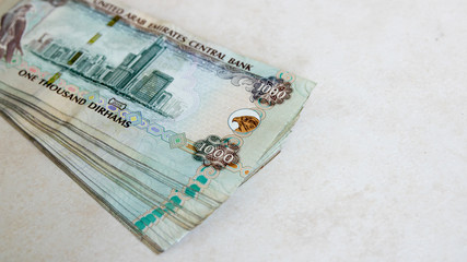 UAE one thousand Dirhams banknotes isolated on a bright background