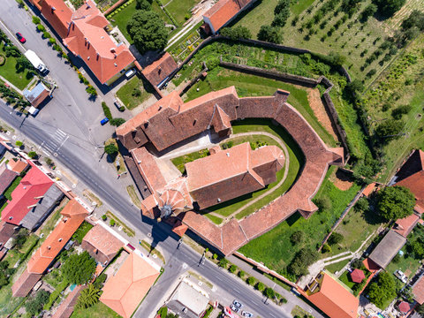Aerial view of the walled Church Sanpetru in the village of Sanpetru near Brasov, Transylvania, Romania