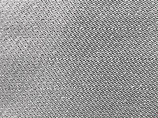 Fototapeta na wymiar gray thread on the fabric