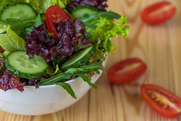 Fresh salad with mixed greens, cherry tomato and cucumber