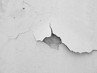 white wall with cracks