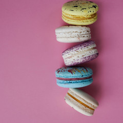Lot of beautiful macarons. pink background