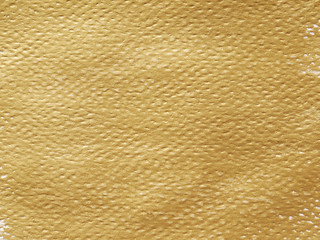 textured background painted in gold paper