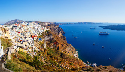 View of Fira village built on top of volcano cliff and blue sea Santorini island, Greece, Europe