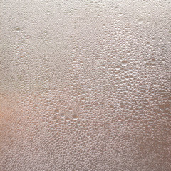 Texture drops of water on the transparent glass