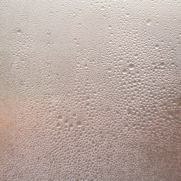 Texture drops of water on the transparent glass