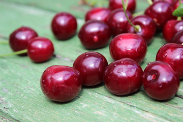 Cherries on a wooden board