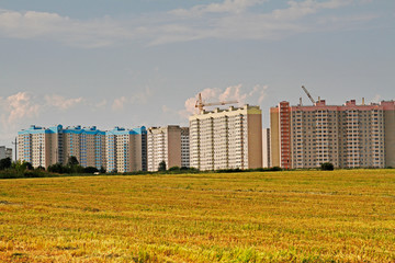 Fototapeta premium Residential buildings under construction in the field